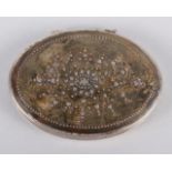 An 18th century white metal and tortoiseshell oval snuffbox with pique decorated lid