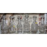 A pair of 19th century ring necked decanters with four other ring necked decanters