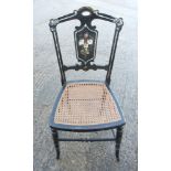 An Arts & Crafts ebonised spindle back bedroom chair, on turned supports, a similar side chair,