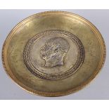 A gilt brass tazza with silvered portrait medallion of an unknown prince