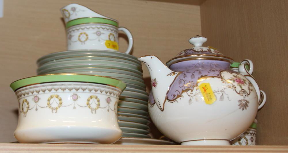 A Cauldron green bordered gilt and wreath decorated part teaset and a Coalport floral decorated