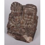 A 19th century plaster bookend, in the form of two seated figures, 4 1/2" high, a shell cameo,