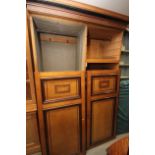 A late 19th century Aesthetic movement ash and inlaid wardrobe, the interior fitted trays and