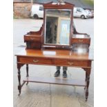 An early 20th century mahogany dressing table, fitted two jewel drawers and mirror, over two further