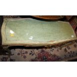 A carved green and white painted serpentine low coffee table, on cabriole supports, 38" long x 15