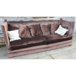 A Knole settee, upholstered in a chocolate velour with down loose seat and back cushions, 96" wide