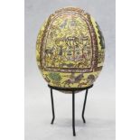An ostrich egg with "mosaic" decoration in early Byzantine style, on metal stand