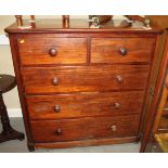 A Victorian mahogany chest of two short and three long graduated drawers, on bun feet, 47" wide