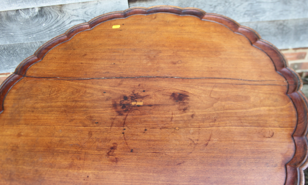 A 19th century mahogany piecrust tilt top occasional table, on baluster turned column and tripod - Image 2 of 5