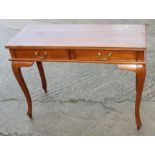 A hardwood side table, fitted two drawers, on cabriole supports, 39" wide x 16" deep x 29 1/2" high