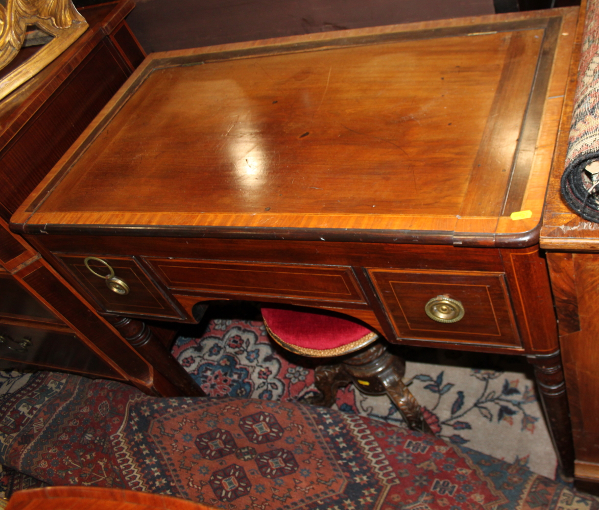 A mid 19th century mahogany and satinwood banded washstand with lift-up top and fitted interior,