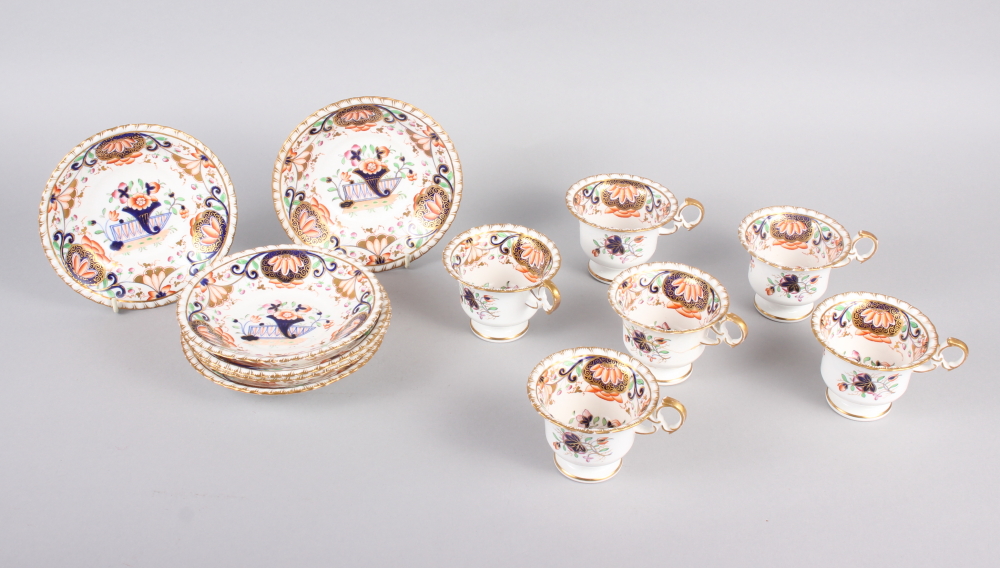 A 19th century English porcelain part tea service for six, in the Imari palette with gilt highlights