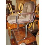 A set of four Pieff chrome conference chairs with brown faux leather backs and arms and chequered