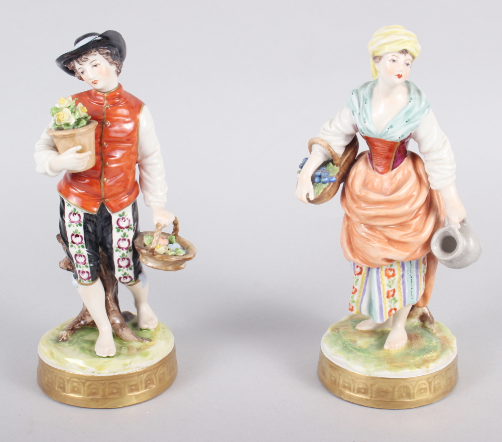 A pair of Continental figures, flower sellers, 7 1/2" high