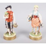 A pair of Continental figures, flower sellers, 7 1/2" high
