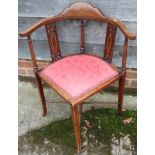 An Edwardian mahogany and inlaid corner chair with pierced splat back on 'X' framed stretcher and
