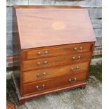 An Edwardian mahogany and satinwood banded fall front bureau with inlaid fan paterae enclosing