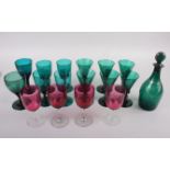 A set of six 19th century green glass conical wines, an early 19th century green glass rum