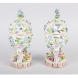 A pair of pot pourri jars with hinged covers and insect and relief floral decoration