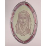 An oval stained glass panel, 15th century woman in wimple, 10" high