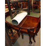 A late 19th century mahogany extending dining table with one extra leaf, on cabriole supports, 58"