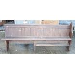 A late Victorian stained pine single-ended pew, 86" long