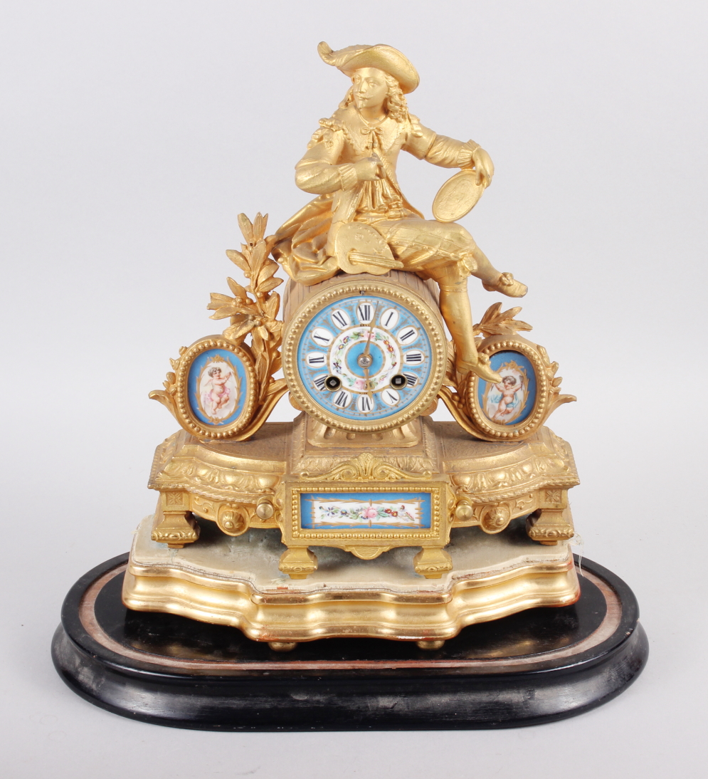 A late 19th century French gilt mantel clock with Van Dyck figure surmount and Sevres porcelain