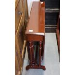 A mahogany Sutherland tea table, on turned supports and splay feet, 40" long x 33" wide x 25 1/2"