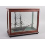 An early 19th century model of a two-mast square-rigger, in an oak and four-glass case, 12 1/2" x