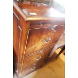 A mahogany three-drawer filing cabinet, 20" wide x 26 1/2" deep x 44" high