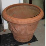 A terracotta planter with swagged decoration, 28" dia x 24" high