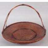 A Japanese ikebana flower arranging basket, 13 3/4" wide