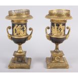 A pair of Regency gilt bronze campana urns with relief figure decoration and satyr mask handles