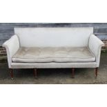 A late Georgian mahogany settee with loose seat squab, on turned and castored supports, 72" wide x