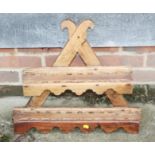 A waxed pine two-tier open spoon rack/wall shelf, on a 'V' support, 21" wide x 4" deep x 19" high
