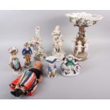 A Continental centrepiece with dancing children and relief flower decoration, 14" high, two