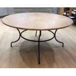 A French travertine type circular marble top table, on wrought iron splay support, 62" dia