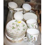 A Wedgwood bone china "Wild Strawberry" pattern part tea service for six and a Royal Doulton bone