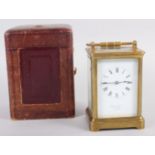 A French five-glass carriage clock with white enamel dial and Roman numerals, retailed by Howell &