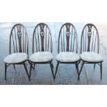A set of four Ercol swan carved splat back dining chairs with panel seats, on turned and stretchered