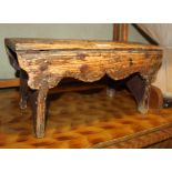 A 19th century pine stool, on panel end supports, 17" wide x 9" deep x 8 1/2" high
