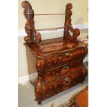 An 18th century Dutch walnut and marquetry bombe commode with open shelves over three drawers and
