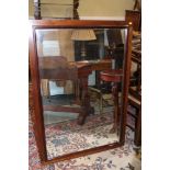 A walnut framed wall mirror with bevelled edge plate, 27" x 48"