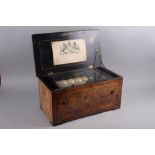 A 19th century six-tune musical box with bells, in burr walnut and kingwood banded