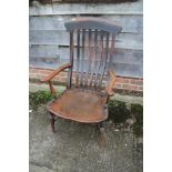 A farmhouse lath back elbow chair with panel seat, on turned and stretchered supports