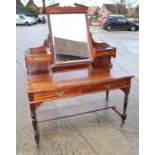 An early 20th century mahogany dressing table, fitted two jewel drawers and mirror, over two further