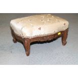 A late 19th century carved walnut serpentine framed low stool, on cabriole supports, 15" wide x 11
