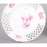 A pair of bone china plates with puce cherub and floral decoration with pierced borders, 9 1/2" dia