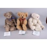 An Ardleigh Elliott musical bear "Nicholas Bear", and four Ashton-Drake Gallery Teddy Bear "