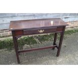 A mahogany side table, fitted one long drawer, on moulded supports, 34" wide x 40" deep x 32" high